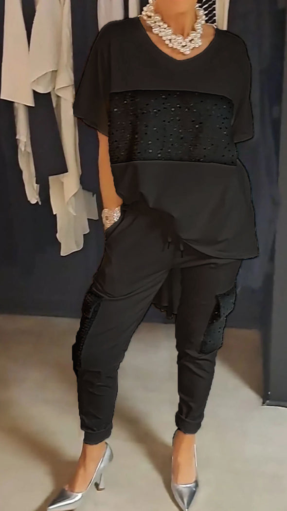 Casual tweedelig pak met ronde hals en top met glinsterende broek