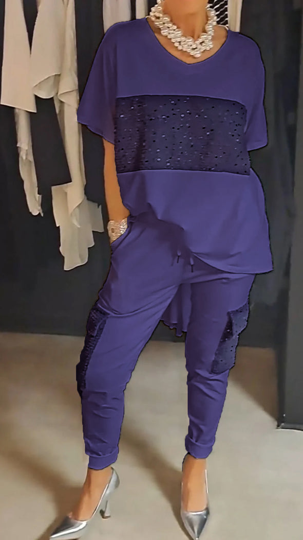 Casual tweedelig pak met ronde hals en top met glinsterende broek