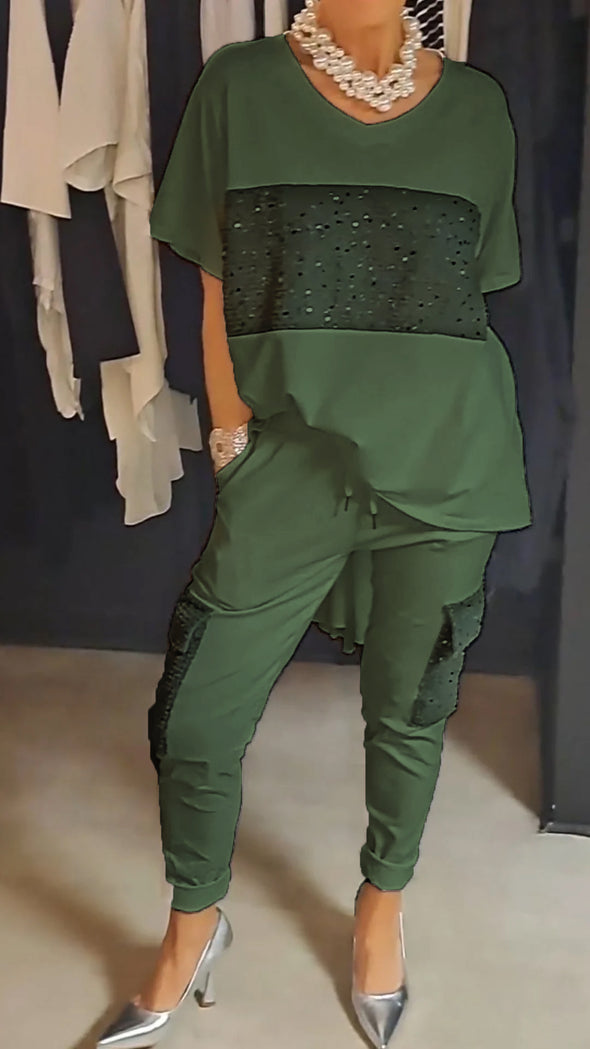 Casual tweedelig pak met ronde hals en top met glinsterende broek