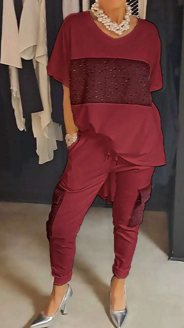 Casual tweedelig pak met ronde hals en top met glinsterende broek