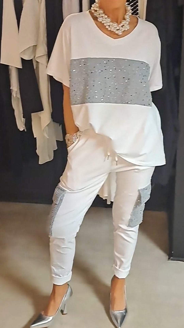 Casual tweedelig pak met ronde hals en top met glinsterende broek