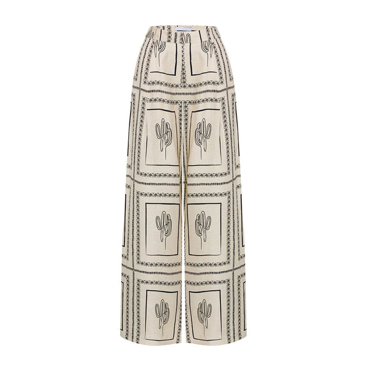 Elegante tweedelige dames outfit met geometrisch patroon: blouse en pantalon met wijde pijpen